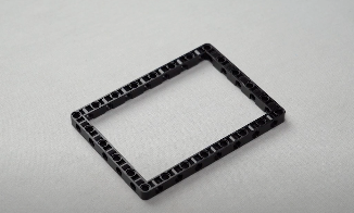 A 15 by 11 block placed on a flat surface as part of the line follower bot construction, illustrating the foundational structure needed for this DIY robotics project.