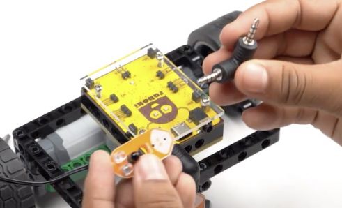 Another proximity sensor connected to an angled port connector on Roboki, emphasizing the importance of sensor technology in building advanced autonomous robots.