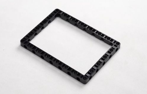 15 by 11 Technic block placed on a flat surface, serving as a foundational component in the Entry Guard bot project, illustrating essential steps in this hands-on STEM robotics activity.