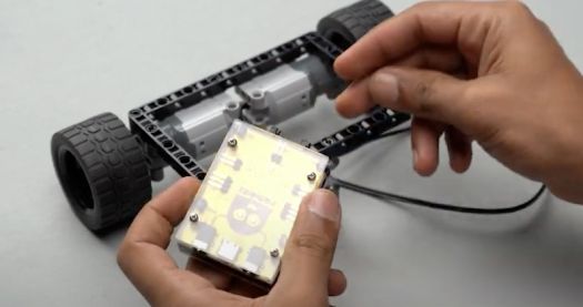 Roboki attached with two pegs, illustrating the integration of the Roboki microcontroller into the line follower bot, enhancing its robotic capabilities.