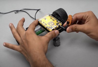 Connecting the proximity sensor to the Roboki microcontroller using the angled port connector, essential for building mobile bots and autonomous robots. This step emphasizes the importance of practical learning in STEM robotics and highlights Yudu Robotics' commitment to developing easy robots for educational purposes.