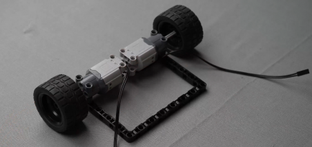 Wheels connected to the axles on both sides of the robot base, demonstrating essential steps in building a mobile bot for engaging robotic projects.