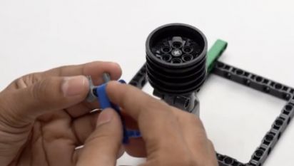 Take a Beam 5 and attach the first hole of the beam to the first peg on the pin connector. This step is crucial in constructing the AI-powered Object Finder Robot, enhancing its structure and stability for effective object detection in robotics projects.