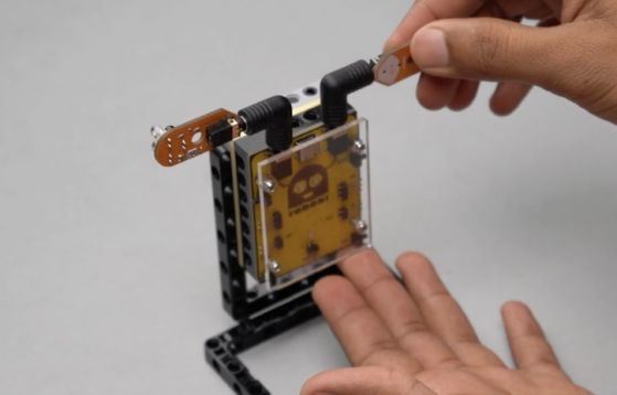 Attach another proximity sensor to Port B of the Roboki microcontroller using angled port connectors, ensuring a secure connection while facing forward. This critical integration enhances the Entry Guard bot's functionality, enabling automated traffic monitoring and real-time detection in this engaging STEM robotics project, ideal for robotic and electronic project enthusiasts focused on sensor applications.