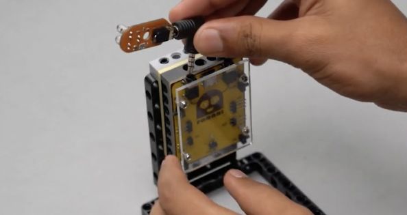 Attach one proximity sensor to Port A of the Roboki microcontroller using angled port connectors, ensuring a secure connection while facing backwards. This integration is essential for the Entry Guard bot, enabling real-time traffic detection and automated traffic management in this engaging STEM robotics project, ideal for robotic and electronic project enthusiasts.