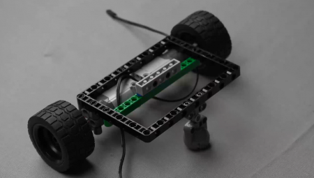 Attaching the 1 by 6 brick with holes and connecting two 90-degree pegs to the Beam 5, showcasing the assembly of an AI-driven robot. This step highlights easy robots construction for robotics enthusiasts, integrating AI in robotics for interactive robot projects.