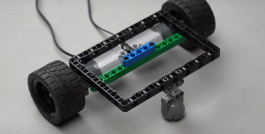 Attaching Beam 5 on top of Beam 15 to strengthen the Follow Me Home bot structure, enabling better sensor detection and autonomous movement.
